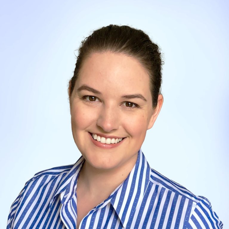 Photograph of Morgan Murphy wearing a blue striped shirt.